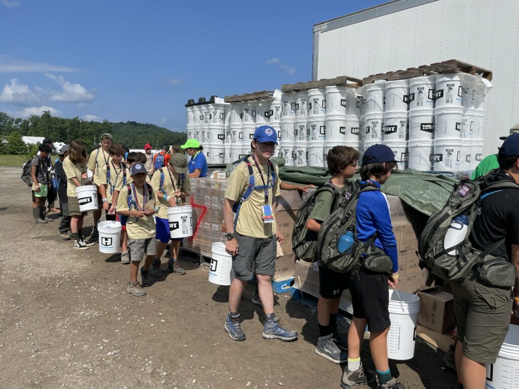 BSA Line of Scouts doing flood buckets